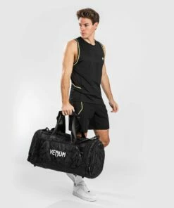 Venum Sports Bag Trainer Lite - Black/camo 15 Venum Sports Bag Trainer Lite - Black/camo -Fighters Europe Store 3c4820dcfb45ee27f675630f46f233ab826c6be3 SPORT BAG TRAINER LITE BLACK DARKCAMO 13