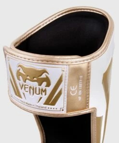 Venum ELITE Shin Guards - White/gold -Fighters Europe Store e60a097ecd90455a1197448726fe930595673983 IMG 0320 2 copie